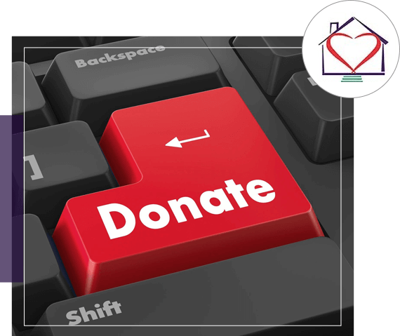 A red "donate" button on a keyboard with a heart icon embossed on it, highlighted to suggest a focus on charitable online contributions.