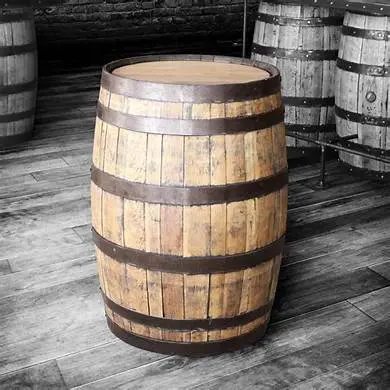 A wooden barrel stands on a wooden floor, surrounded by several other barrels, with a selective color effect highlighting its tones.
